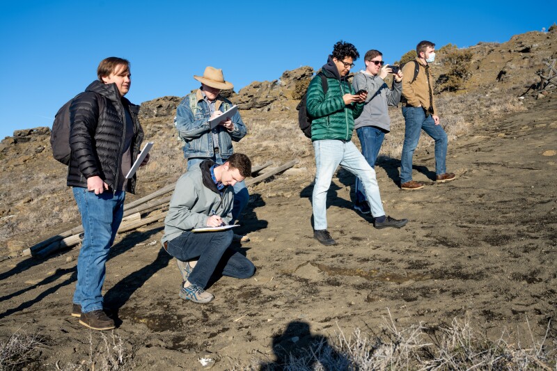 Geology students take notes on a field trip