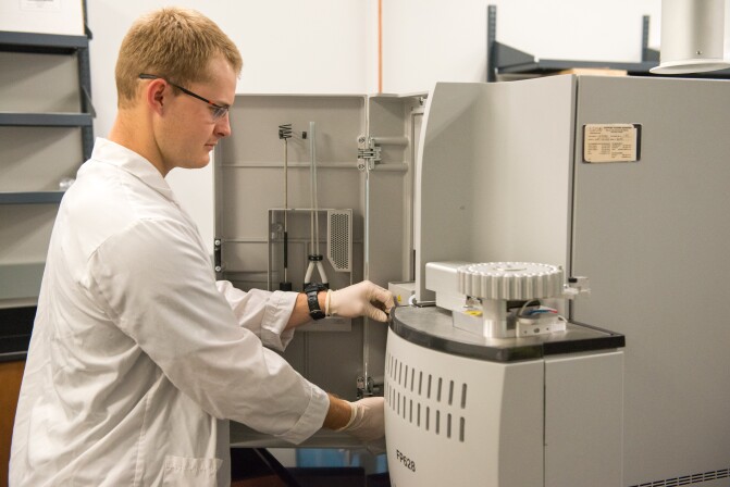 Food Science students working with machines in the Instrument Room.