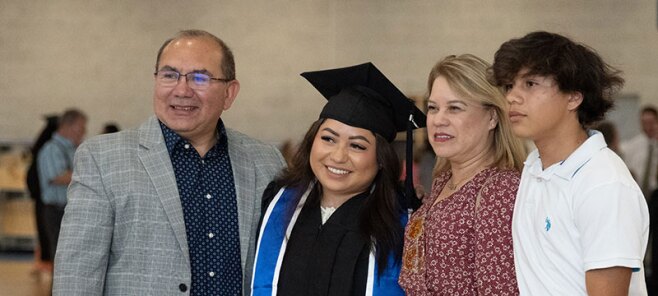 Graduate taking a picture with her family