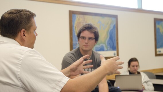 Matt Miles consults with a student one on one