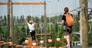 a girl on the ropes and balls section of the course