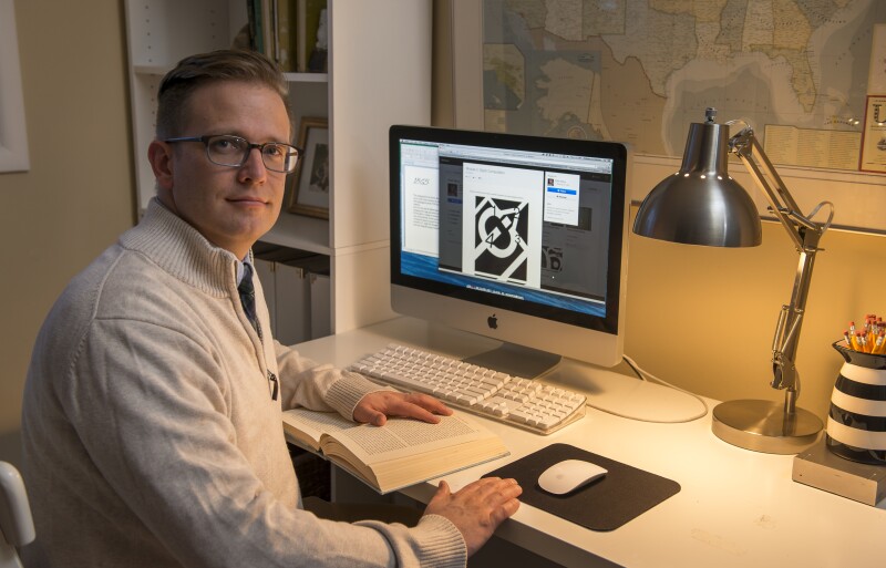 An online instructor prepares a class assignment for his online course at BYU-Idaho.