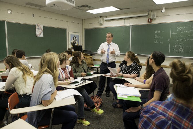 An English instructor teaches a literary interpretation class.