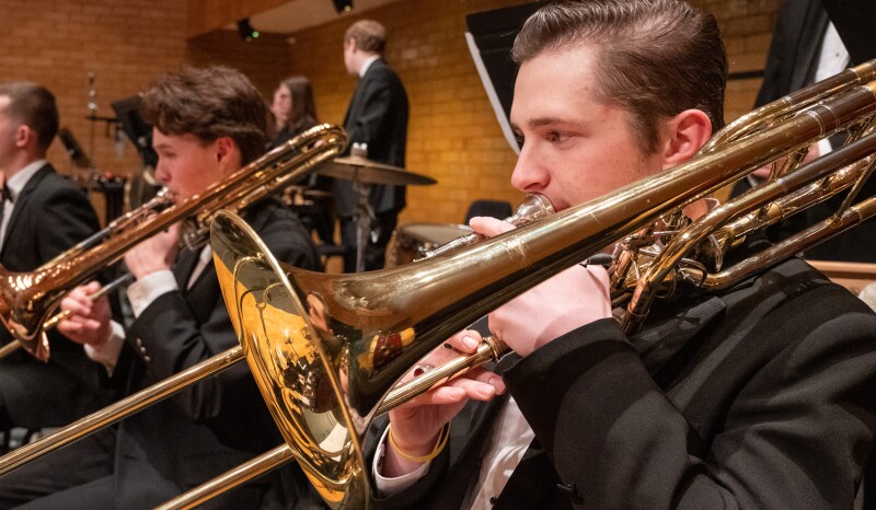 Student band member playing the trombone.