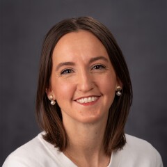 A professional photo of Adjunct Faculty Aubrie Mema.