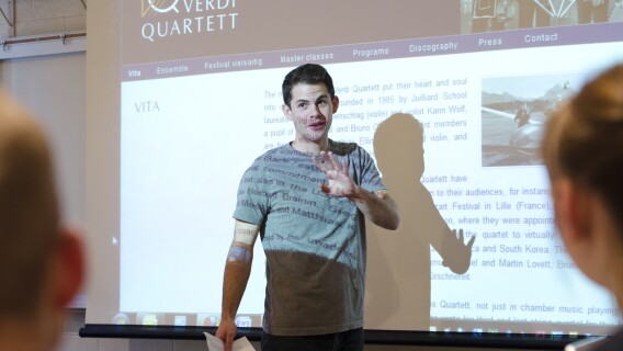 A student gives a presentation in front of a Humanities Class.