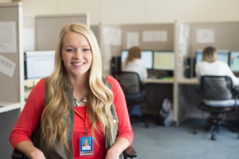BYU-Idaho student employee smiling at the camera.