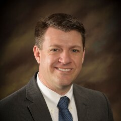 A professional photo of Faculty TL Julander.