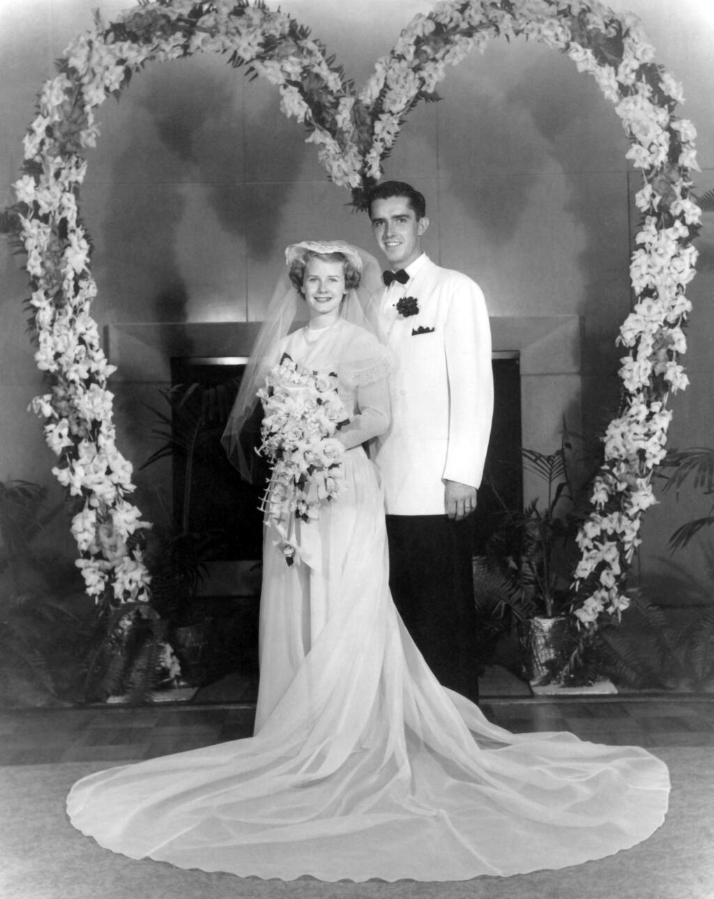 A bride and groom standing together.