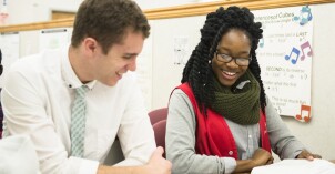 A female BYU-Idaho tutor helps another student learn math skills in the Math Study Center.