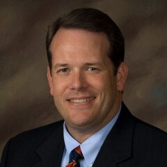 A portrait photo of Darin Merrill