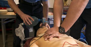 Cory Marriott and his peer pass off their CPR test