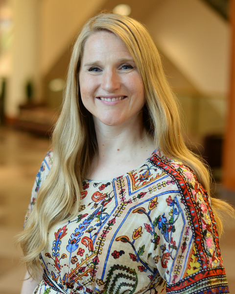A professional photo of Laura Paulsen Howe smiling.
