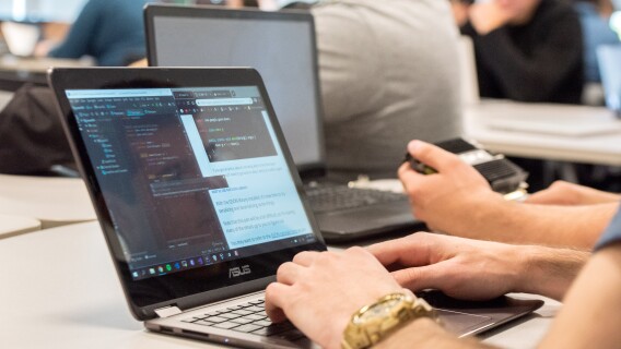 Students complete work on their laptops in a Computer Science Class.