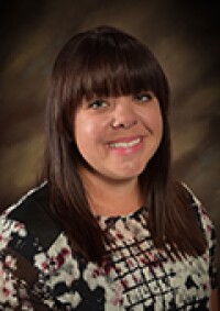 A portrait photo of Jennifer Lindsay Perkes.