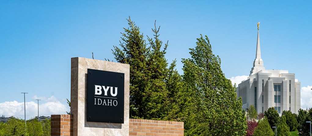 BYU-Idaho sign with Rexburg Temple in the background