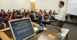 A health psychology professor teaches students