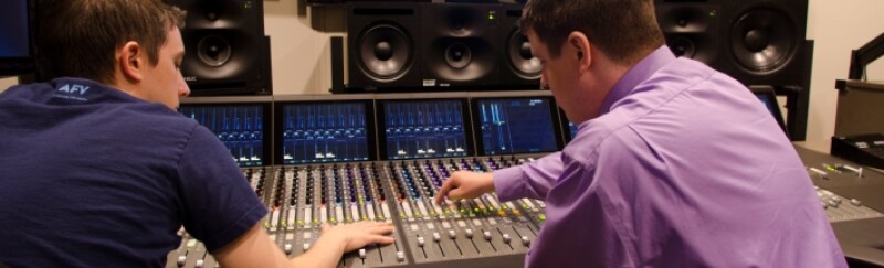 Two students work in the audio room