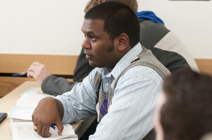 A BYU-Idaho student listens with great interest in a political science foreign affairs class.