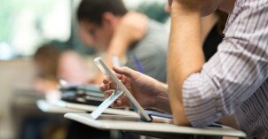 Student uses their device to study and take notes during class