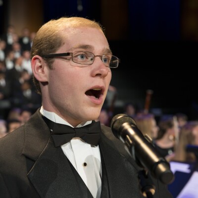 A singer singing from the BYU-Idaho Sacred Music Production