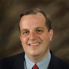 A portrait photo of Eric d'Evegnee