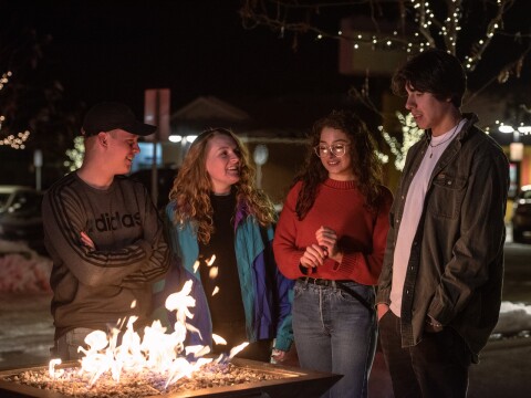 A group of students enjoy the lights on Main St. and Center St.