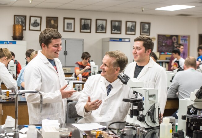Students work in Brother Griffith's Microbiology Lab.