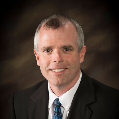 A portrait photo of Ron Kinville