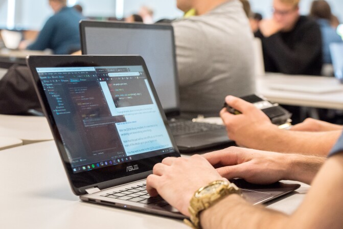 Students complete work on their laptops in a Computer Science Class.