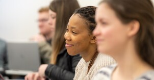 Students sit in a Social Work class.
