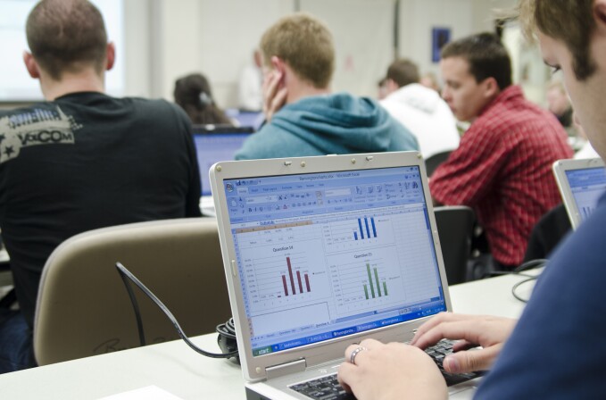 Students work on their computers in a Business Management Class.