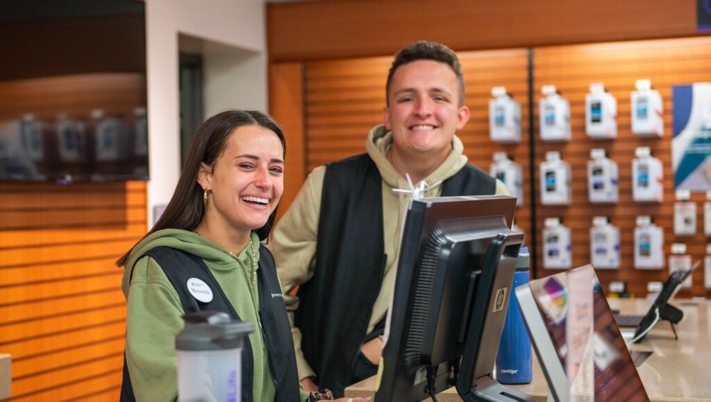 Student employees working in the tech center at the University Store.