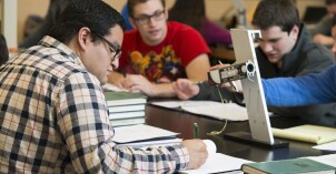 Students in a Physics class work to solve problems.