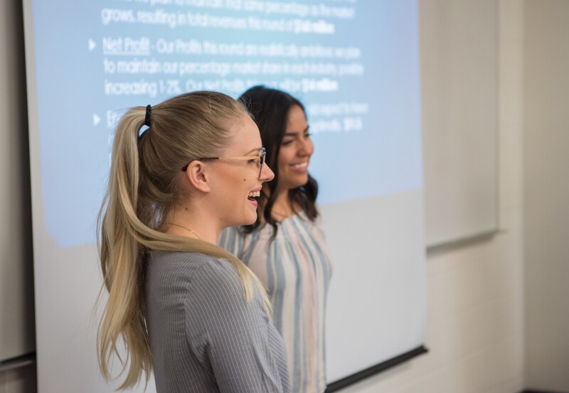 BYU-Idaho students standing at the front of the class doing a presentation.