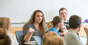 A marriage and family studies student discusses with the rest of class