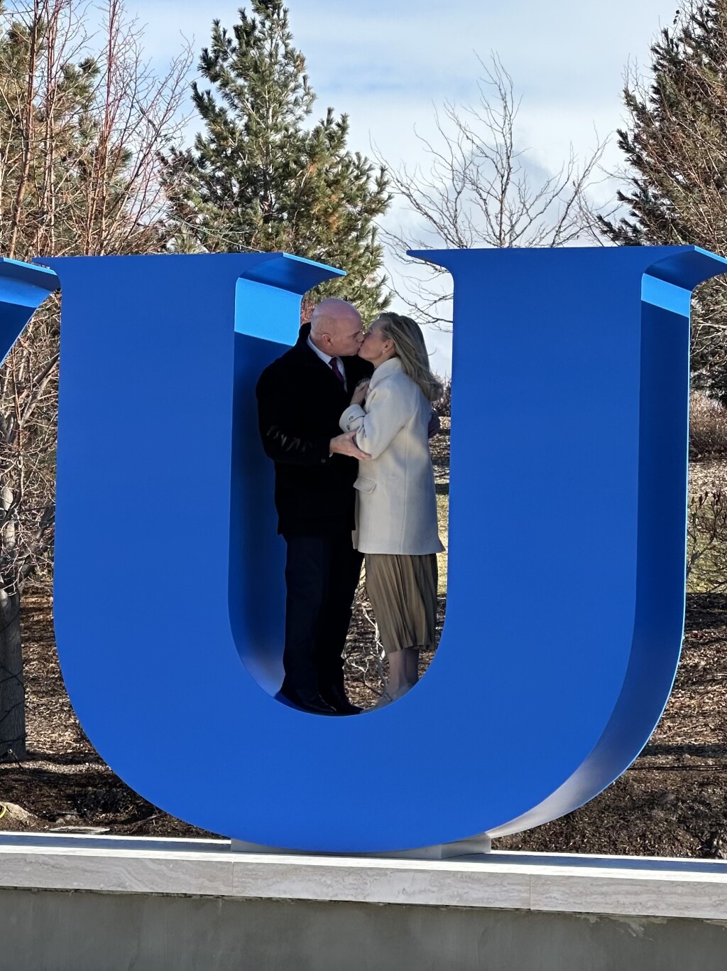 President and Sister Meredith climbed inside the “U” for a kiss to establish a new tradition.