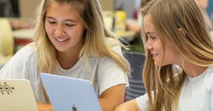 Two girls studying together