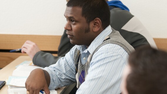 A BYU-Idaho student listens with great interest in a political science foreign affairs class