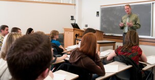 A professor discusses psychology content with students.