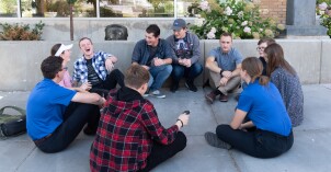 A group of students get together for a fun activity with their student mentors