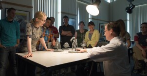 Brother Josh Abegglen critiques, with the help of his students, other students work from his Entertainment Illustration class.