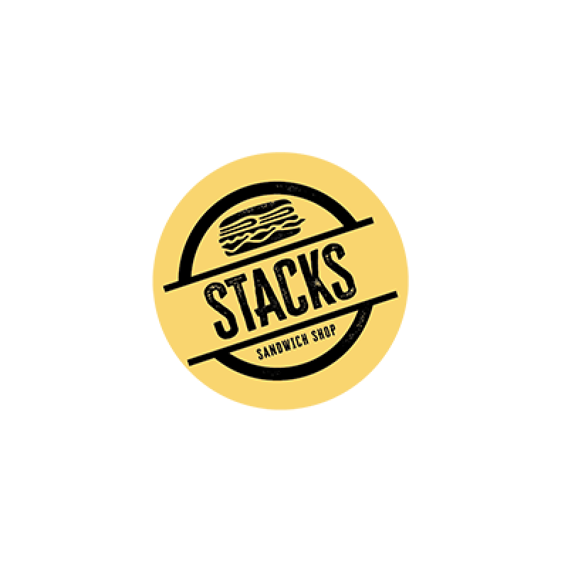 Stacks Logo "STACKS; SANDWICH SHOP" written in black, slanted to the left with yellow background; cartoon drawing of a sandwich also in black, on top of "STACKS"