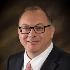 A portrait photo of Benjamin Gleason