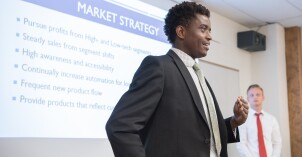 Students present their final group projects in a Business Essentials Class.