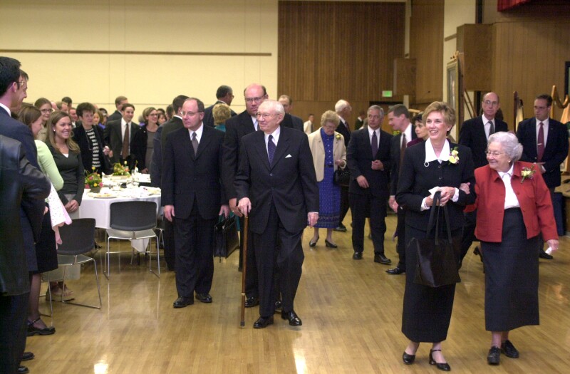President Hinckley and others walk in the gym