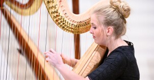 A BYU-Idaho student playing the Harp in the Harp Ensemble