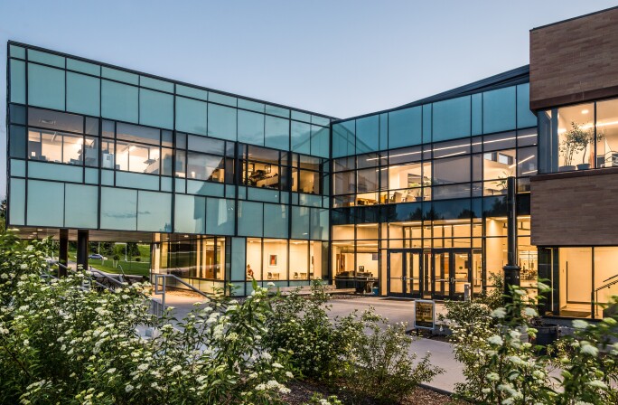 The BYU-Idaho Science and Technology Building lit at dusk.