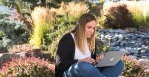 Student doing homework on her laptop