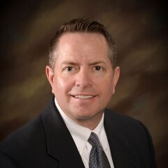 A professional photo of Faculty Wade Huntsman.